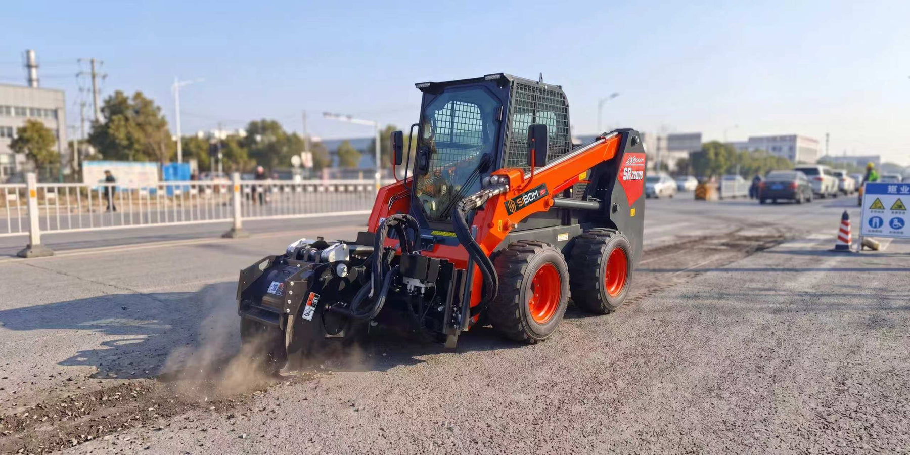 Sibom loader with cold planer on road maintenance work