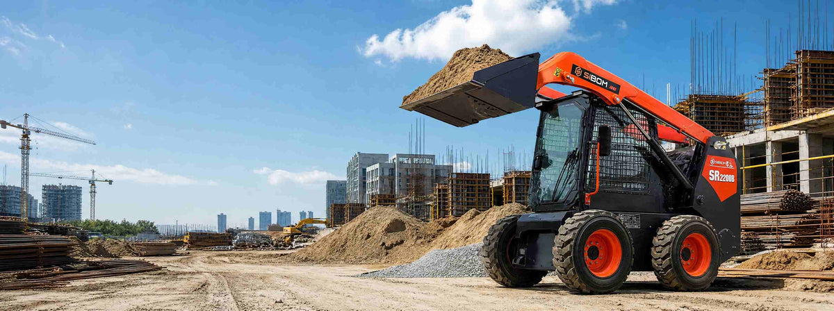 SIBOM SR2200B skid steer loader on a construction jobsite heavy equipment attachments